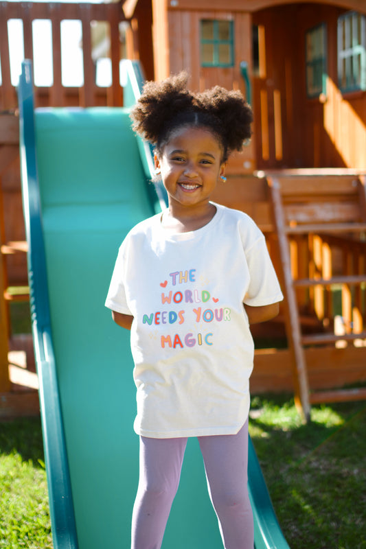 The World Needs Your Magic Kids Tee
